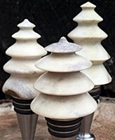 carved deer antler trees on stainless steel bottle stopers