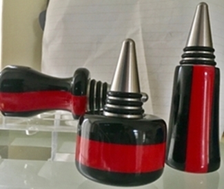 Red and black resin on stainless steel bottle stoppers