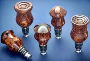 stainless stoppers with wood turned tops