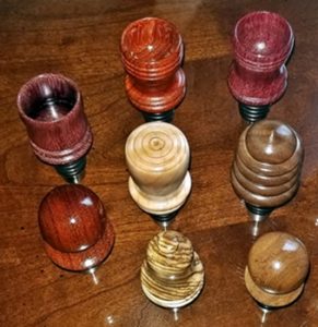 stainless stoppers with turned wood tops