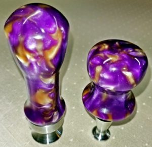 stainless bottle opener and stopper with purple resin tops