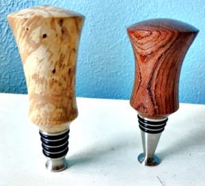 stainless stoppers with turned wood tops