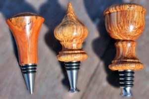 stainless stoppers with woodturning tops