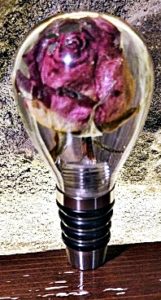 red rose in resin on top of stainless stopper