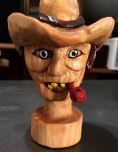 carved man on stainless stopper