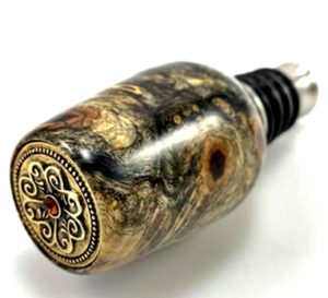 antique button on top of bottle stopper