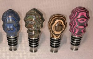 stainless stoppers with turned colorwood toppers