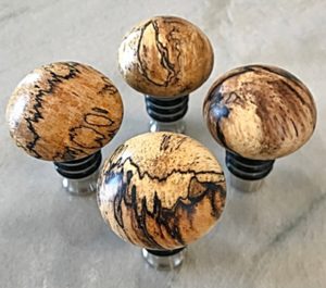 mushroom caps on stainless steel bottle stoppers
