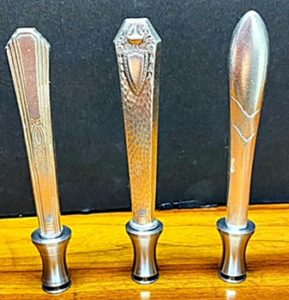 Vintage silverware knife handle on can tab lifter