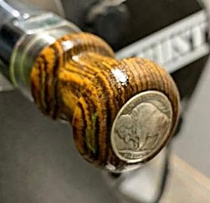 Buffalo nickle on a bottle stopper