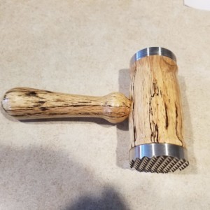 Wood meat and chicken tenderizer mallet.