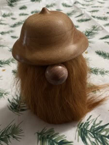 Turned Gnome with a threaded ring for the lid on the bottom. 