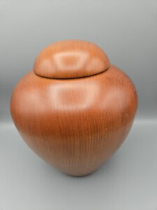 Beautiful wood urn turned on the lathe. 