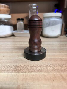 Niles stainless steel meat tenderizer with a Walnut handle. 